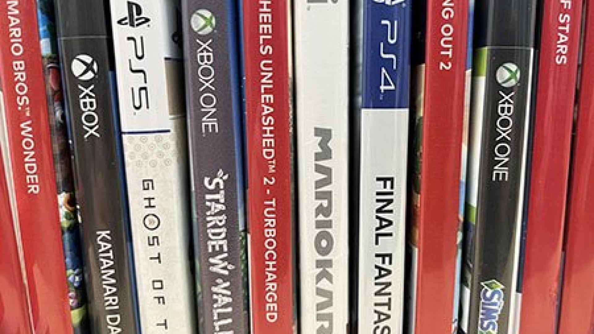 The spines of several video games stacked vertically together