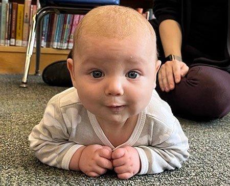 Infant smiling at camera